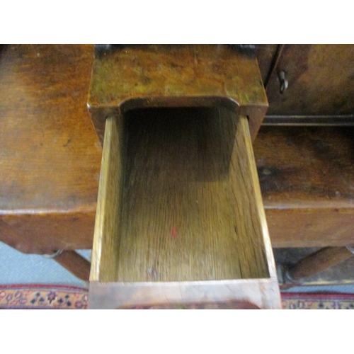 181 - An early 20th century walnut dressing table mirror above four drawers flanking a central cupboard do... 