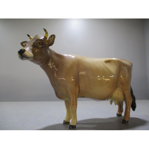 192 - A Beswick Friesian bull, marked Coddington Hilt bar, a Beswick bullock and a Beswick and a Beswick J... 