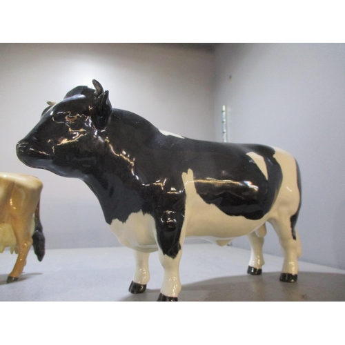 192 - A Beswick Friesian bull, marked Coddington Hilt bar, a Beswick bullock and a Beswick and a Beswick J... 