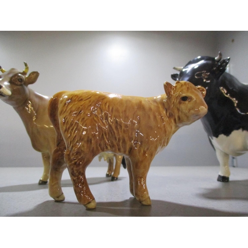 192 - A Beswick Friesian bull, marked Coddington Hilt bar, a Beswick bullock and a Beswick and a Beswick J... 