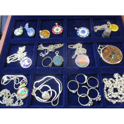 252 - Mille Fleurie pendants, coins pendants, mixed silver items stamped 925 and white metal items housed ... 