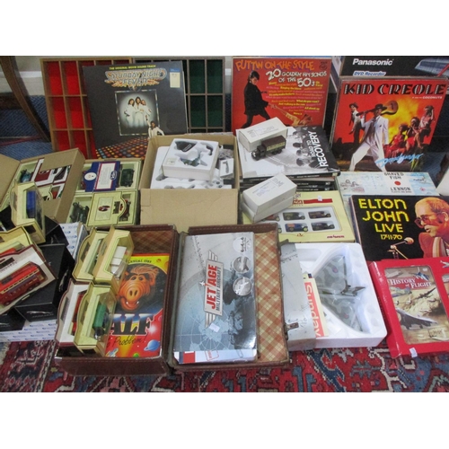63 - Records, diecast and other model vehicles to include busses, airplanes and cars along with a small s... 