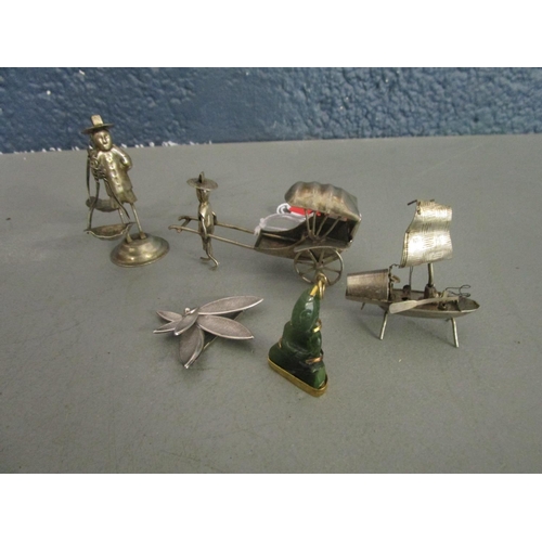 151 - A group of Chinese white metal figurines, a Chinese junk, a 800 silver brooch and a gilded white met... 