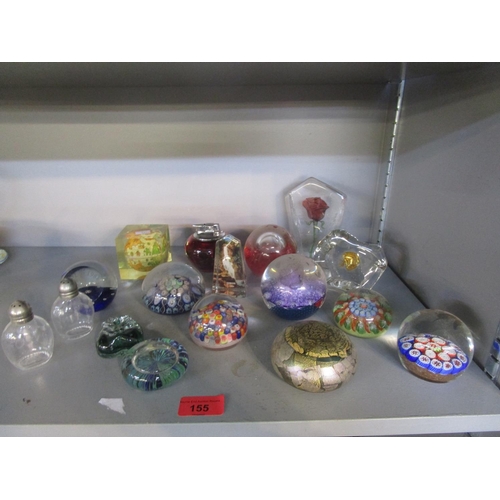 155 - A collection of paperweights and a table lighter to include Strathearn and an Isle of Wight paperwei... 