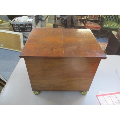 158 - An early 20th century walnut coal box with brass feet
Location: FR