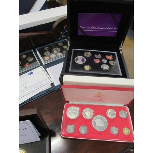 213 - A collection of annual proof coin sets 1989-1994 and 1998, along with a Diamond Jubilee Executive Pr... 