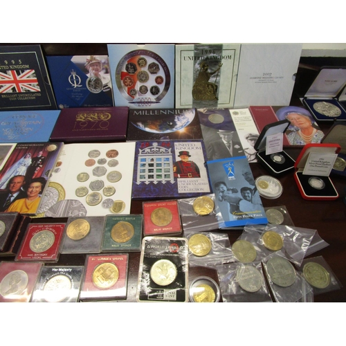 214 - A collection of cased silver proof coins, coin sets, medals and other commemorative coins to include... 