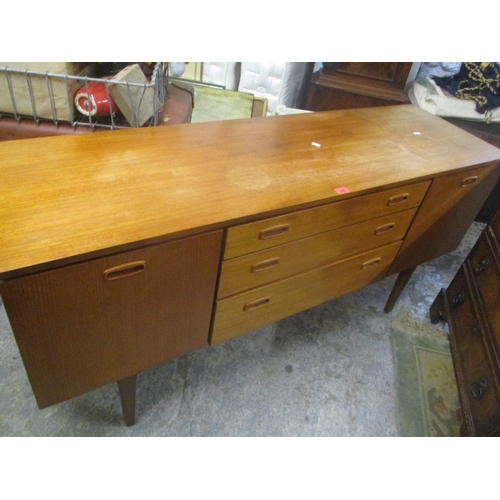 246 - A mid 20th century Retro teak sideboard having three drawers flanked by two cupboard doors 72.5cm h ... 