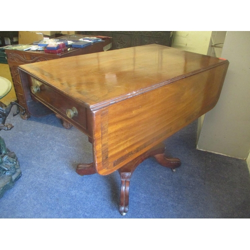 268 - A Regency mahogany fall flap Pembroke table having a single drawer and a quadrofoil base, 73