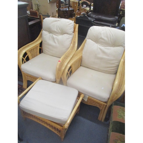 275 - A pair of conservatory wicker armchairs and a foot stool
Location: C