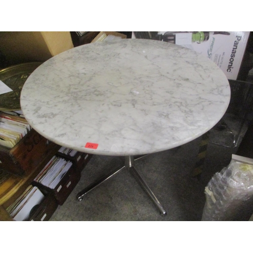 276 - A modern circular marble topped occasional table on chrome supports, 74