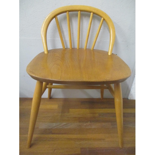 294 - An Ercol beech and elm dressing table chair with a low hoop back, on turned legs
Location: C