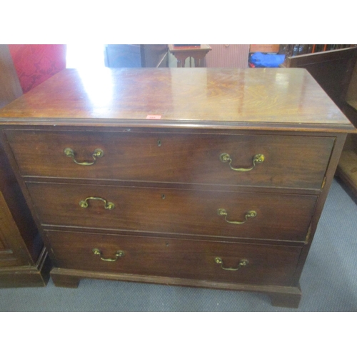 295 - A George III mahogany chest of three long drawers, on bracket feet, 77