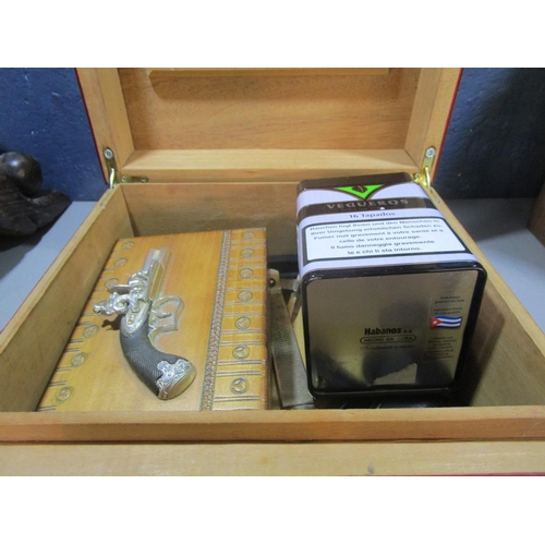 304 - A Humidor with various smoking accessories and a wooden model of a canon
Location: 7.1