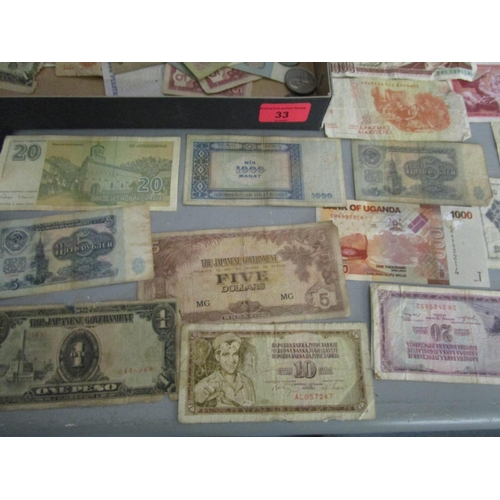 33 - A collection of over 100 foreign banknotes to include Turkish, American and Japanese notes, along wi... 