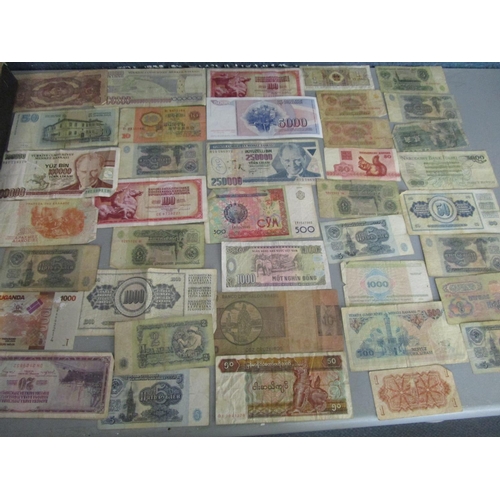 33 - A collection of over 100 foreign banknotes to include Turkish, American and Japanese notes, along wi... 
