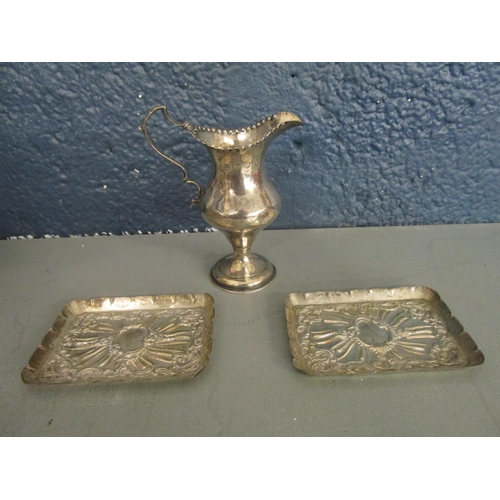 5 - A George III silver cream jug, London hallmarks, makers mark GG and a pair of silver embossed pen tr... 