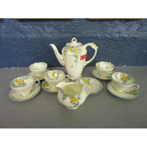 57 - A Paragon floral patterned coffee set A/F
Location: 8.2
Condition:age related hairline cracks and an... 