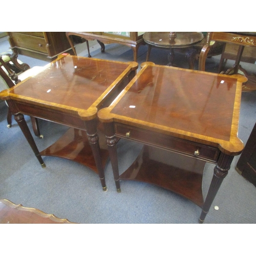 75 - A pair of modern mahogany two tier side tables having inset drawers, two brush slides, fluted taperi... 