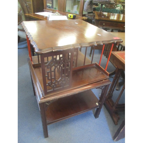 85 - An early 20th century mahogany table with later adjustments having an Oriental style swivel top 76 c... 