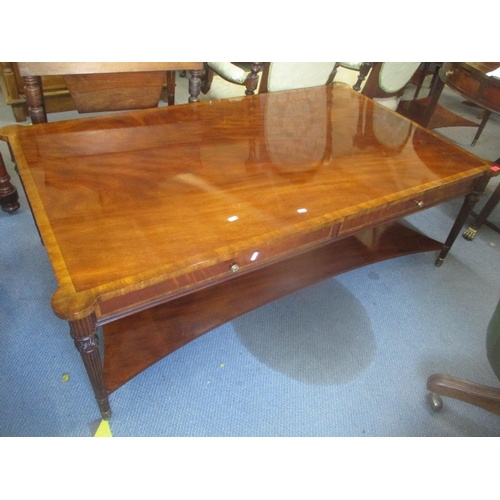 92 - A large reproduction mahogany two tier coffee table having two inset drawers and fluted tapering leg... 