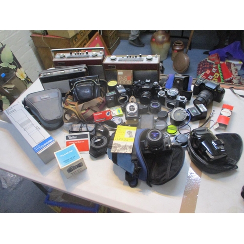 179 - A selection of vintage cameras to include Nikon, Zenit, Pentax, together with lenses and three vinta... 
