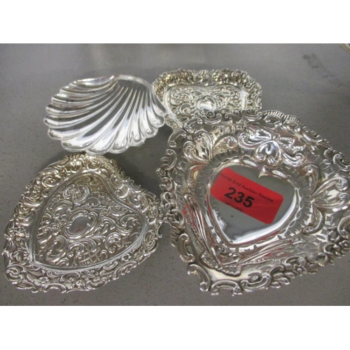 235 - Four silver trinket dishes to include a pair of Victorian embossed, heart shaped dishes
Location: CA... 