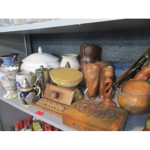 74 - A mixed lot of ceramics and African treen items to include a Royal Doulton vase A/F, tankards, a dru... 
