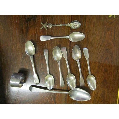 544 - A small group of Georgian and later silver spoons, a napkin ring with machine turned decoration and ... 