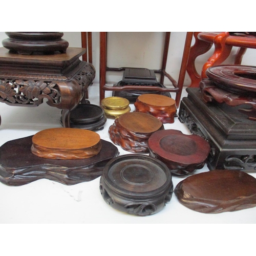 238 - A collection of Chinese hardwood stands and bases, of various shapes and sizes.