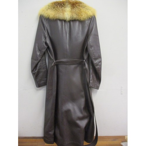 244 - A retro ladies dark brown leather coat with red fox fur collar, together with a full length mid brow... 