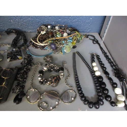 150 - A quantity of costume jewellery to include Indian White metal coin jewellery, gold coloured spectacl... 