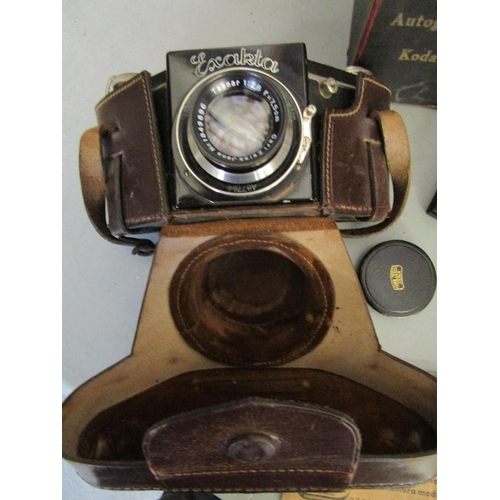 258 - A mixed lot of vintage cameras, light meters and accessories to include an Ihagee Exakta leather cas... 