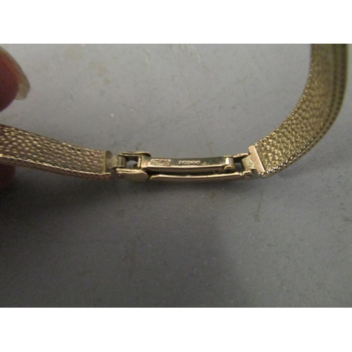 308 - A Tissot 9ct gold ladies wristwatch on an integral 9ct gold bracelet strap, hallmarked London 1967, ... 