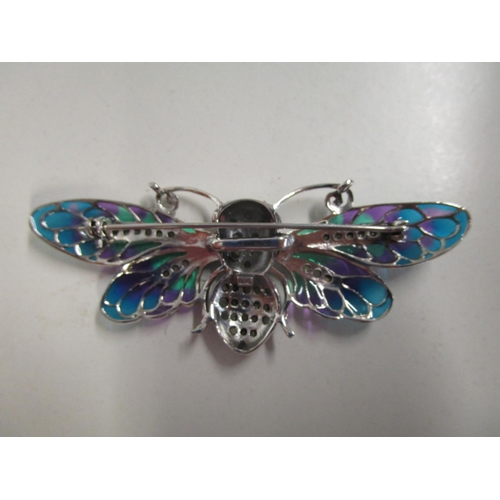 323 - Large silver moth/winged insect brooch/pendant set with ruby eyes and marcasites, and inlaid with co... 