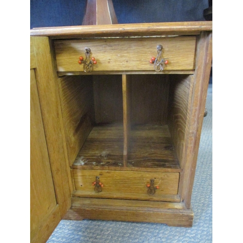 87 - An Arts & Crafts carved oak smokers cabinet depicting peacocks A/F