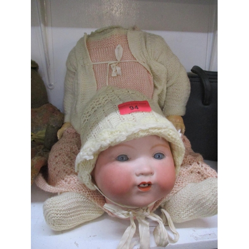 94 - An Armand Marseille bisque headed doll with two teeth showing, A/F, together with vintage handbags a... 