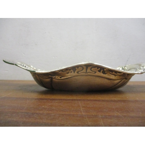 71 - An Art Nouveau silver dish with embossed ornament 23cm w 130g