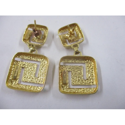 79 - A pair of 18ct gold double square, pierced earrings, 8.7g