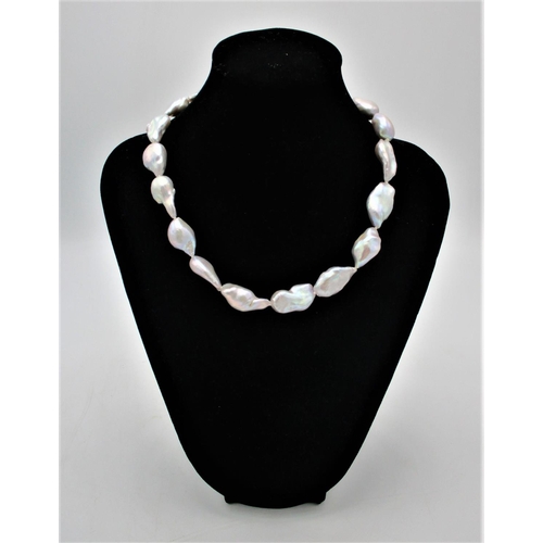 393 - A single strand baroque pearl necklace, with a white metal magnet clasp, 41 cm long