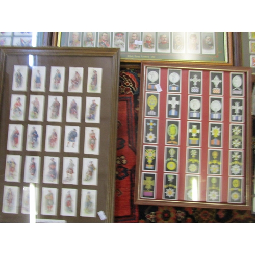 366 - A group of framed and glazed sets of cigarette cards to include Wills cigarettes of Allied Army Lead... 