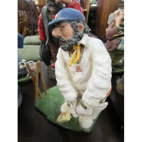 371 - A collection of 1980s and later figurines to include a model of an Essex cricketer batsman artist mo... 