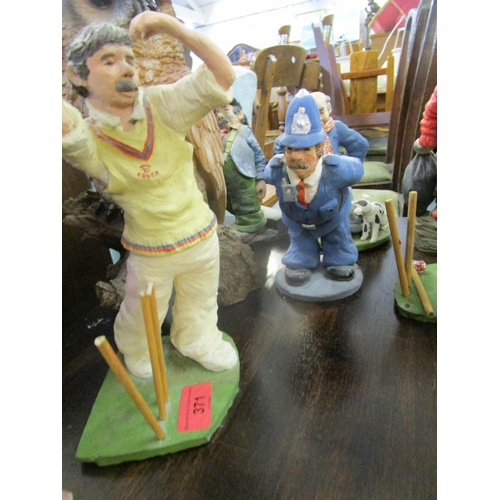 371 - A collection of 1980s and later figurines to include a model of an Essex cricketer batsman artist mo... 