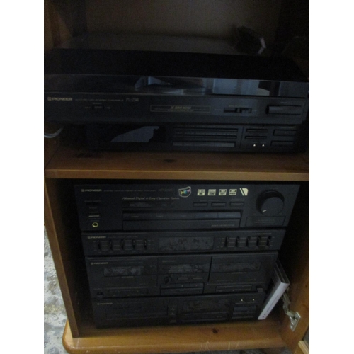 372 - A Pioneer stereo stacking system in a pine cabinet together with a Marantz amplifier, Sansui disk pl... 