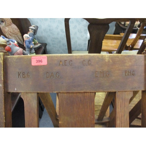 396 - Circa 1900, six standard chairs, one carver and one stool, all in oak with rush seats, the carver in... 