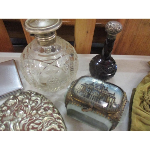 5 - A sterling silver topped and cut-glass perfume bottle and another together with a small silver blott... 