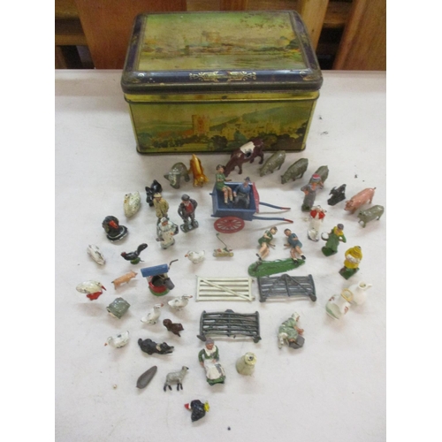 88 - A quantity of lead and other figures and models, mainly farm animals, housed in a vintage tin box