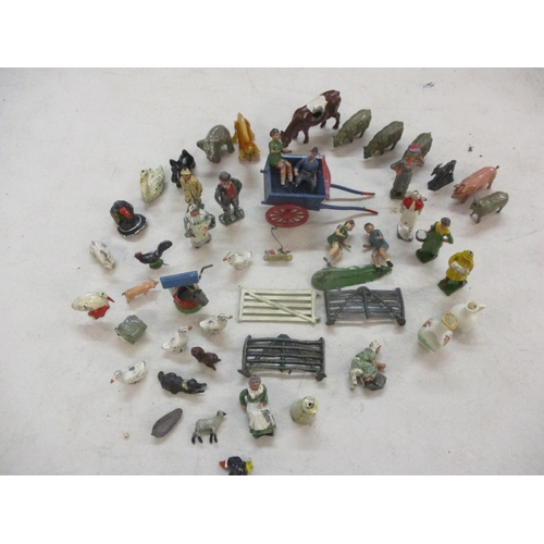 88 - A quantity of lead and other figures and models, mainly farm animals, housed in a vintage tin box