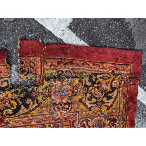 297 - A late 19th century Turkish carpet with repeated motifs, A/F, approx 16' x 13'