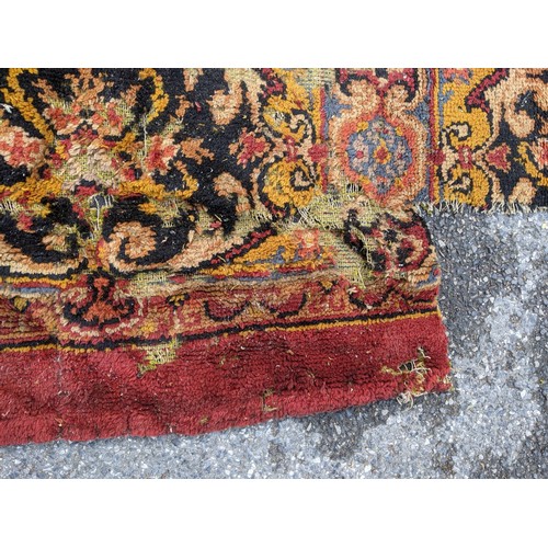 297 - A late 19th century Turkish carpet with repeated motifs, A/F, approx 16' x 13'